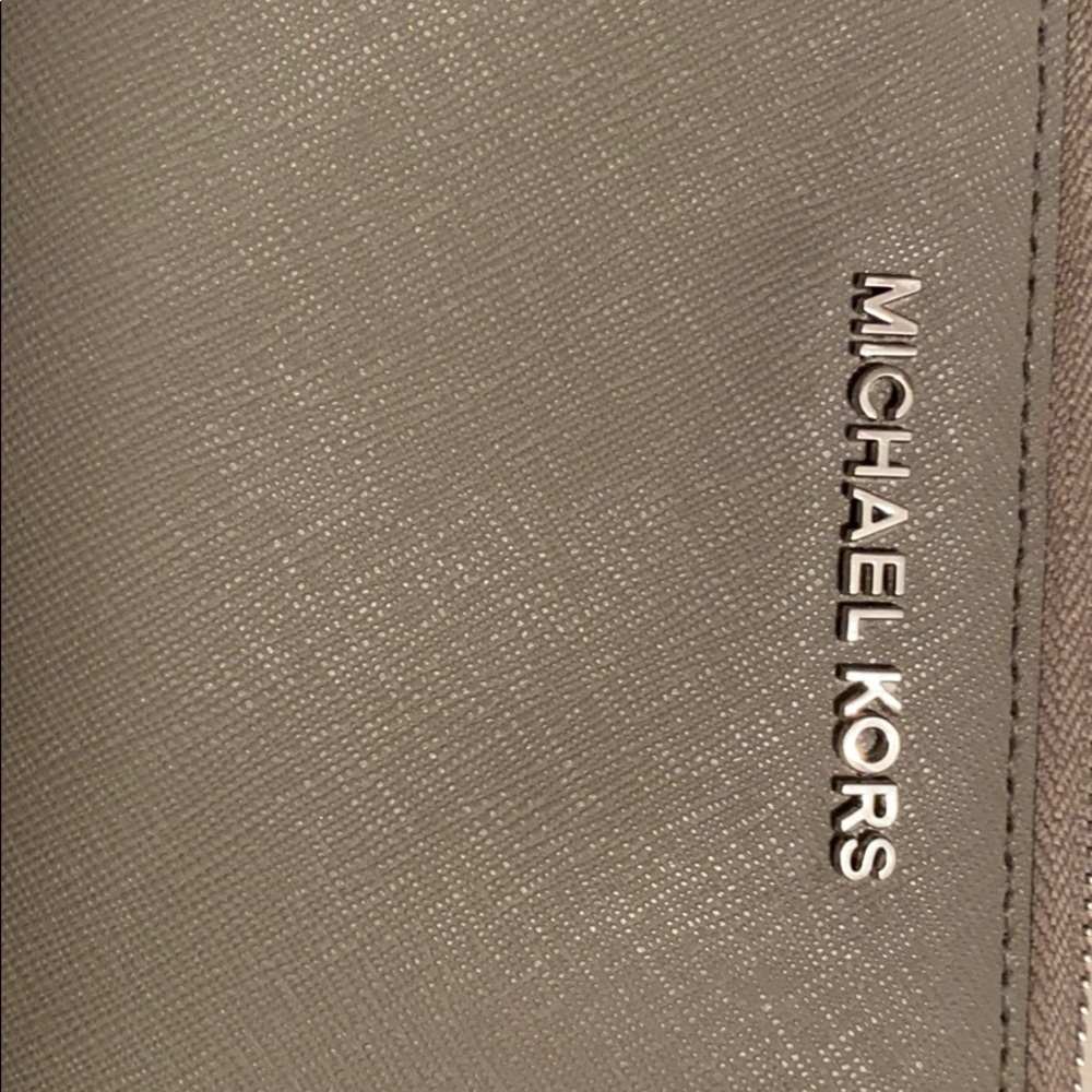 Grey Michael Kors wallet puff ball key chain